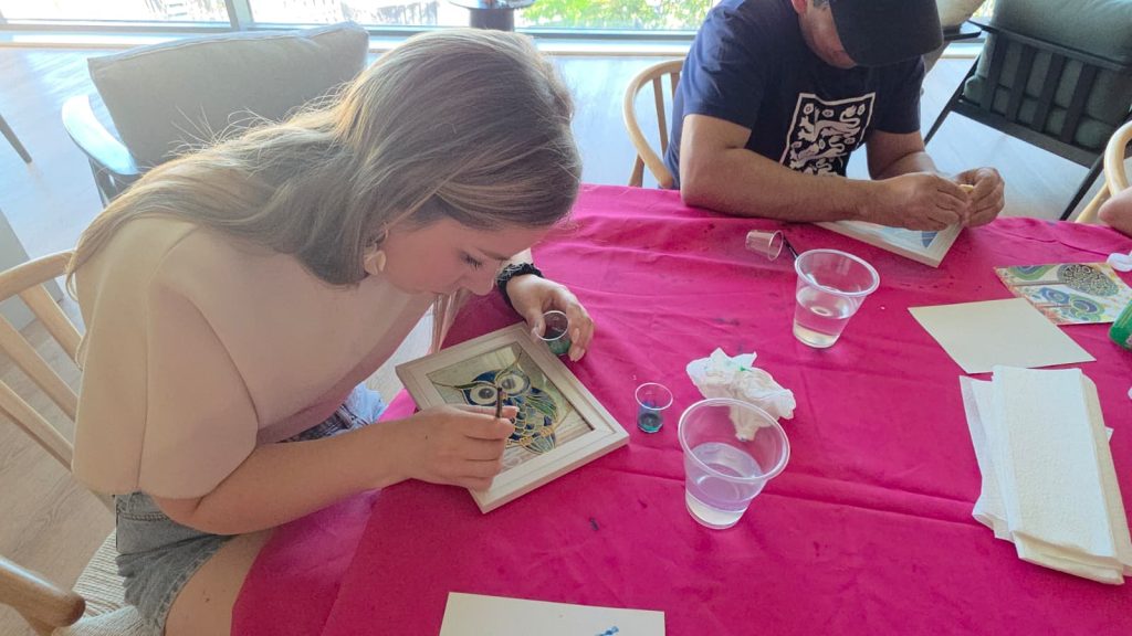 Art Club member concentrating on her painting at One Maidenhead