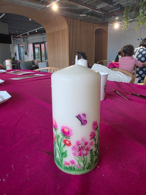 Hand-painted floral candle made at an Art Club session