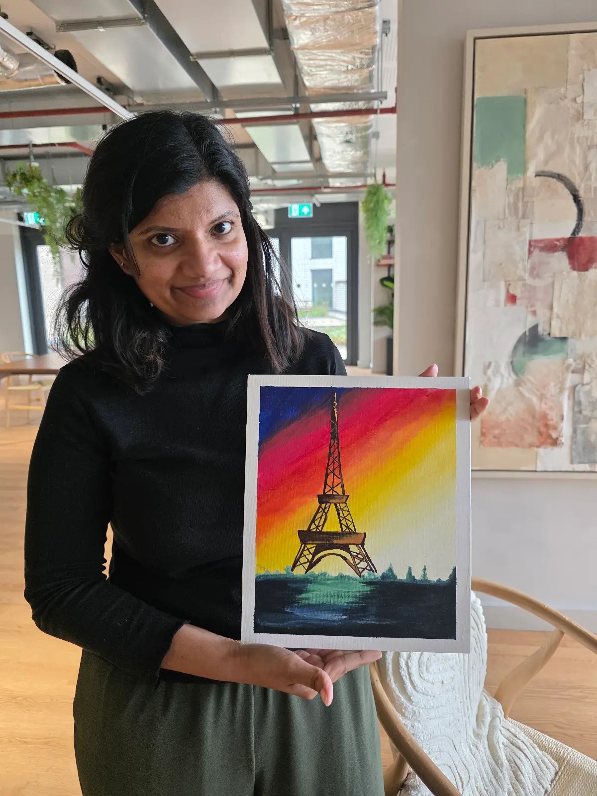 Devi Arts student with finished painting