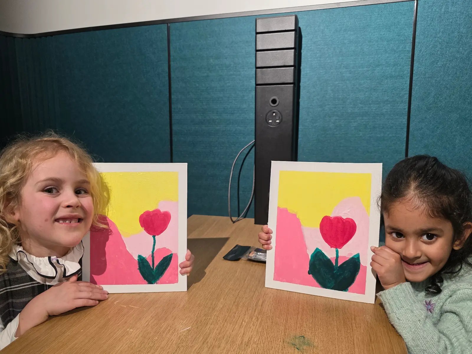 Devi Arts students with finished paintings