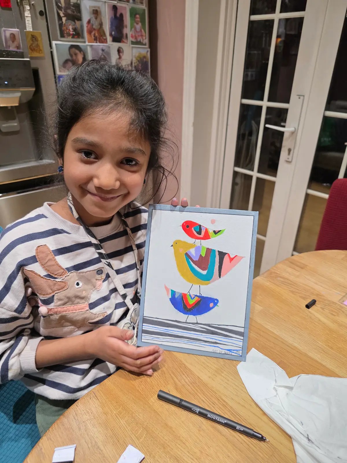 Devi Arts student with finished painting