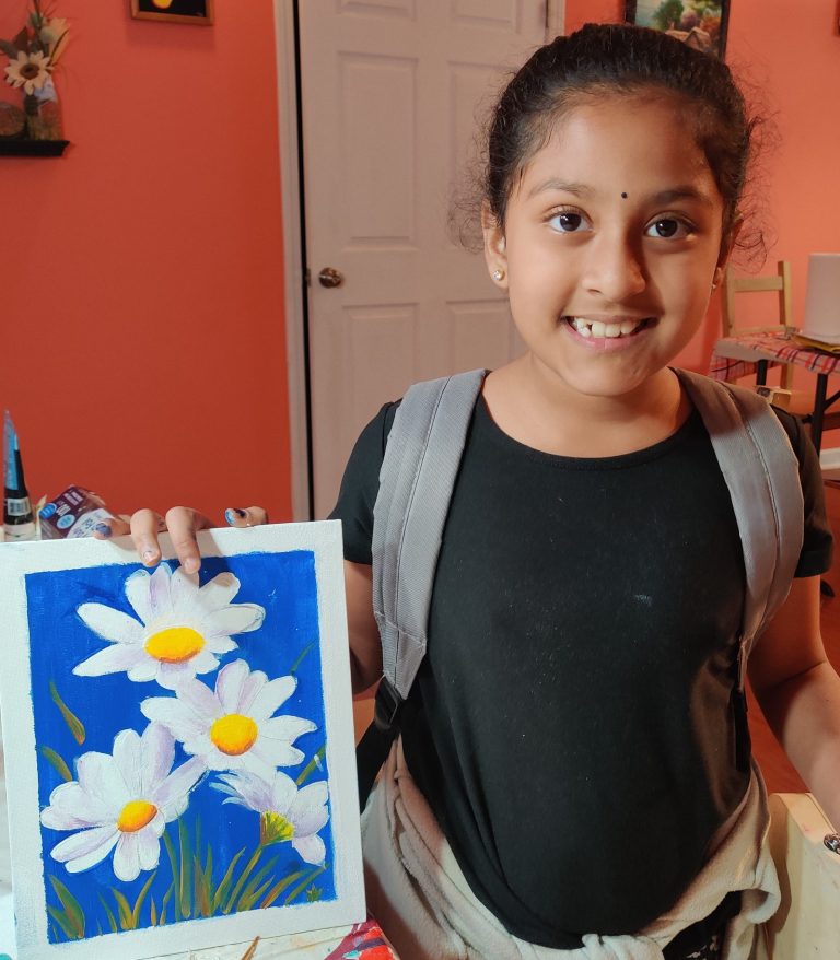A young student's finished daisy painting